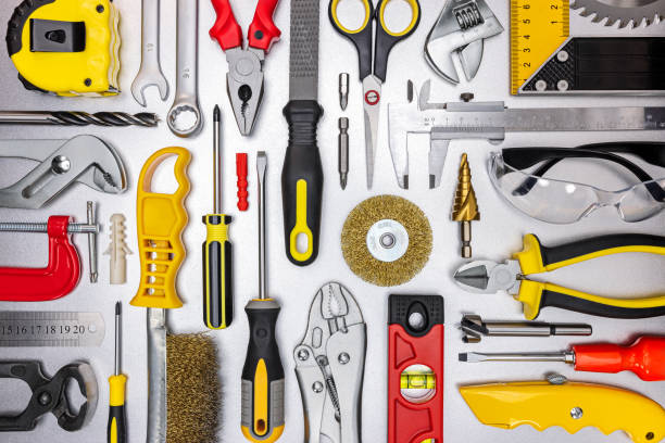 grey working desk with different professional tools and instruments. top view